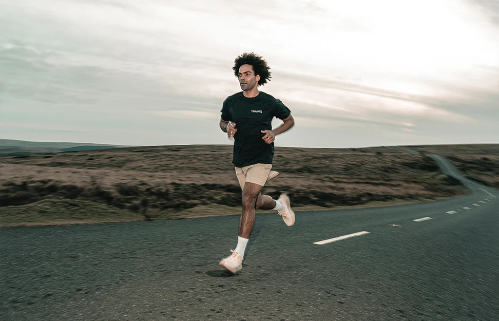 man running on a high way