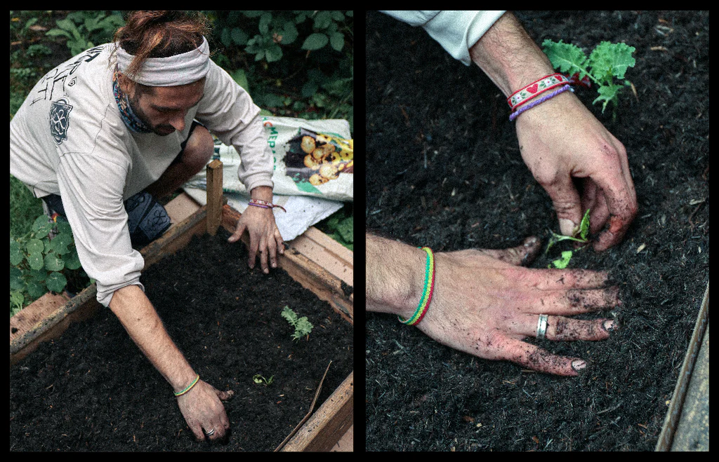 man working with his hands in soil